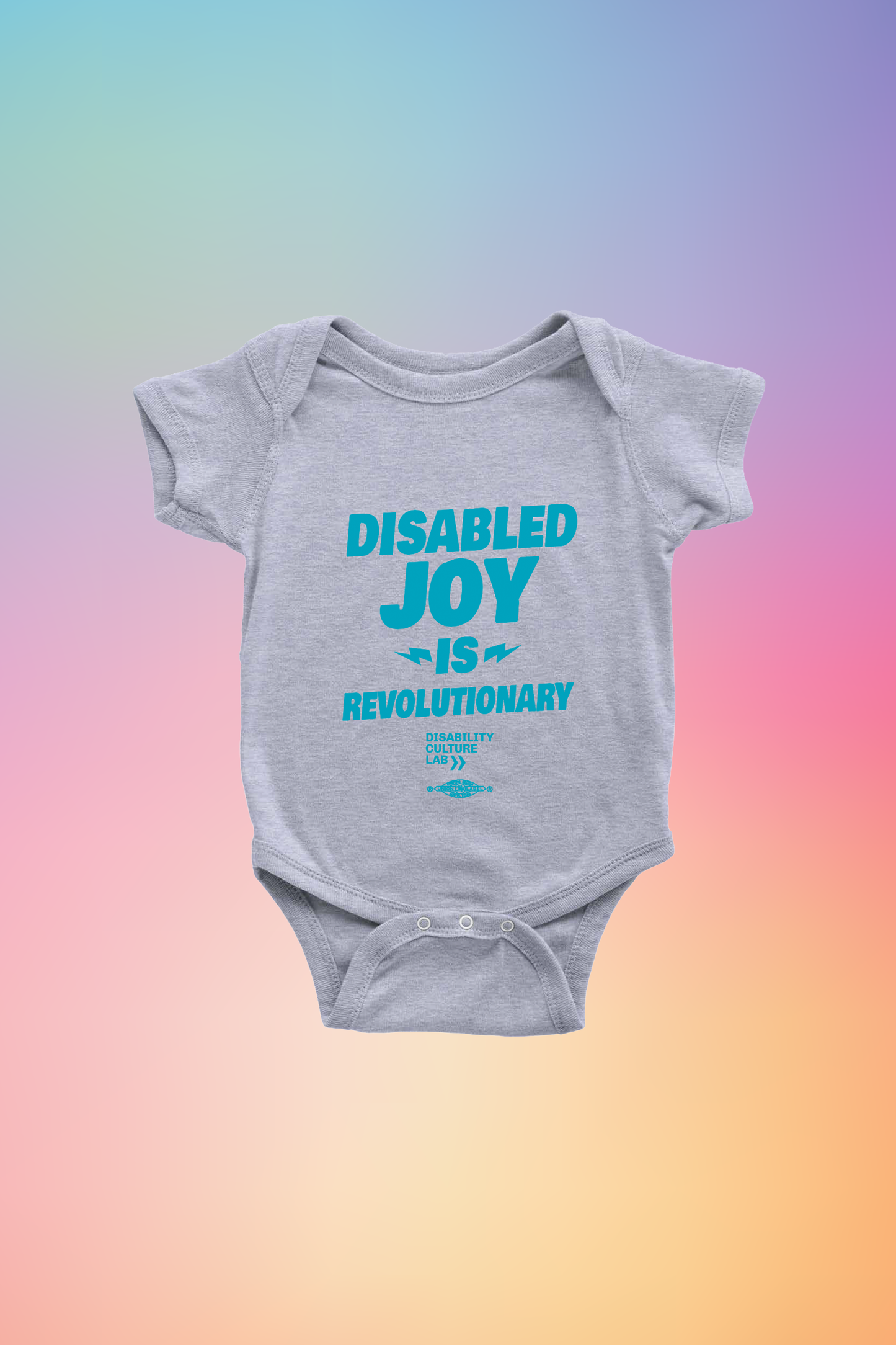 Gray onesie with the turquoise words "Disabled Joy Is Revolutionary" and the turquoise Disability Culture Lab logo. 