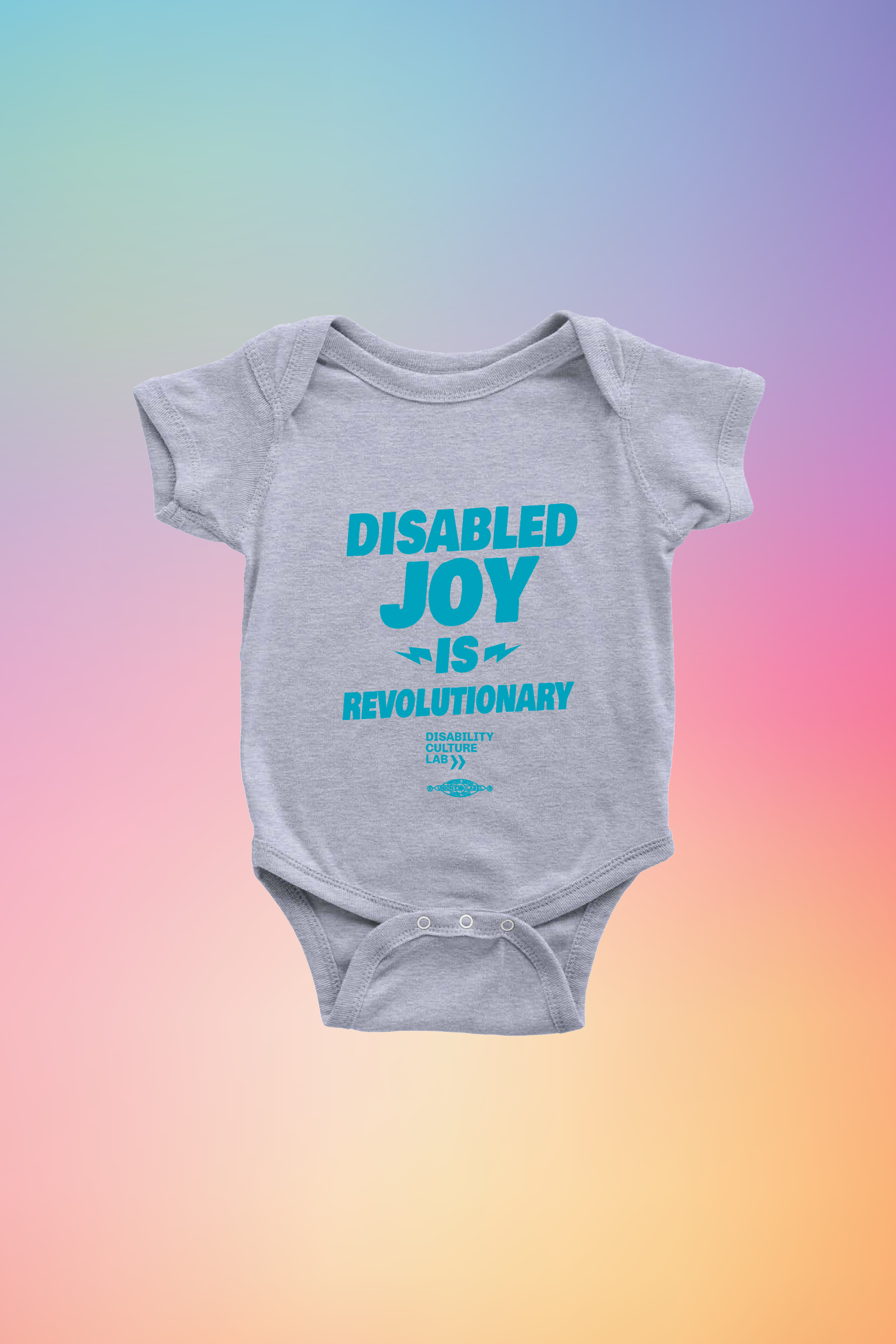 Gray onesie with the turquoise words "Disabled Joy Is Revolutionary" and the turquoise Disability Culture Lab logo. 