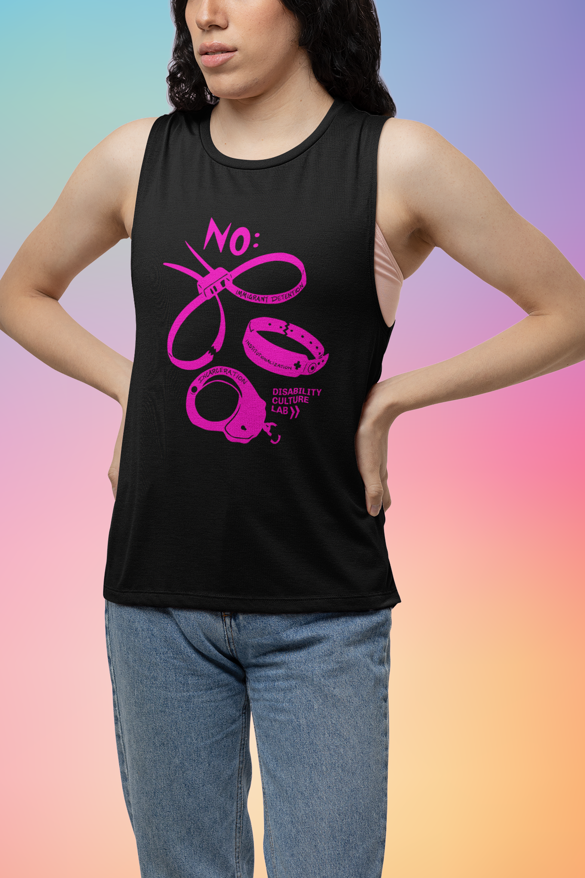 Person with long dark hair wearing blue jeans and a black muscle tank with hot pink scan of hand cut paper art (scherenschnitte) featuring the designs of three types of institutional and correctional hand restraints: (1) A pair of zip tie restraints with the words “Immigrant Detention” inscribed on one side, (2) A hospital identification wrist band with the word “Institutionalization” and a medical cross written on it, and (3) A metal handcuff with the word “Incarceration” inscribed on top. "NO" is at top.