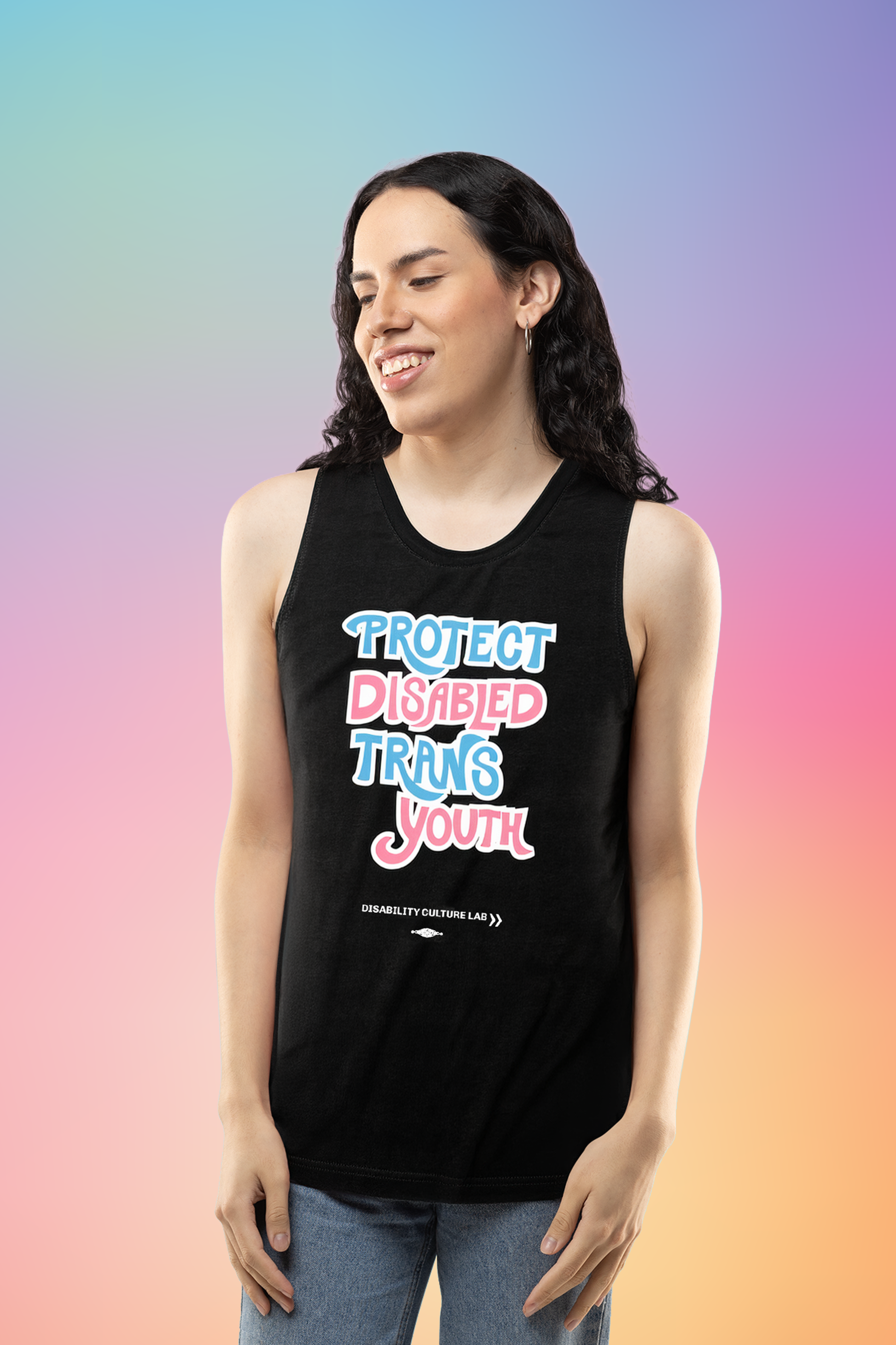A light-skinned person with long black hair wearing blue jeans and a black muscle tank that reads, “Protect Disabled Trans Youth” in hand drawn letters in the trans pride flag colors (light pink, sky blue, and white). Below is the white Disability Culture Lab logo.