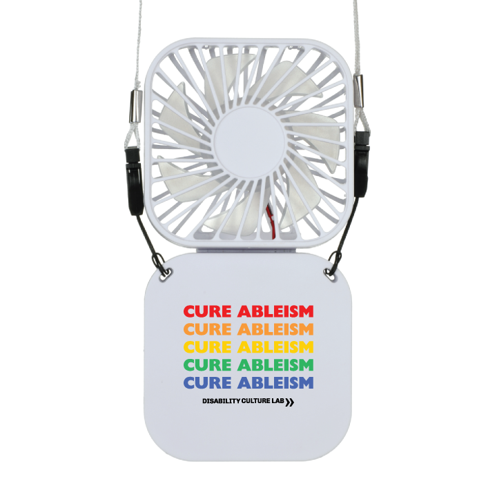 A small white portable fan that reads "Cure Ableism" five times in red, orange, yellow, green, and blue, and the white Disability Culture Lab logo.