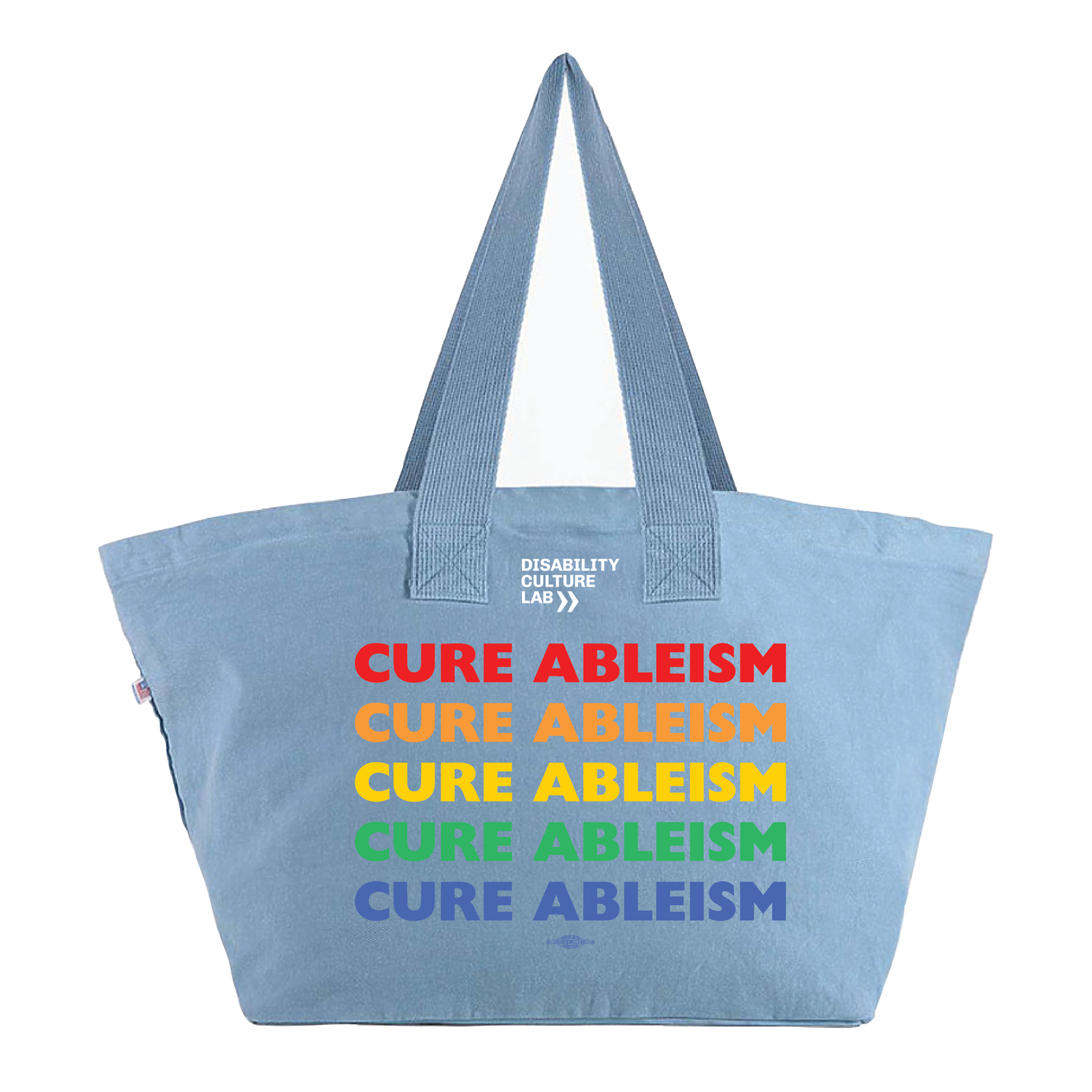 Wide blue denim summer tote with “Cure Ableism” written five times in rainbow pride colors. 