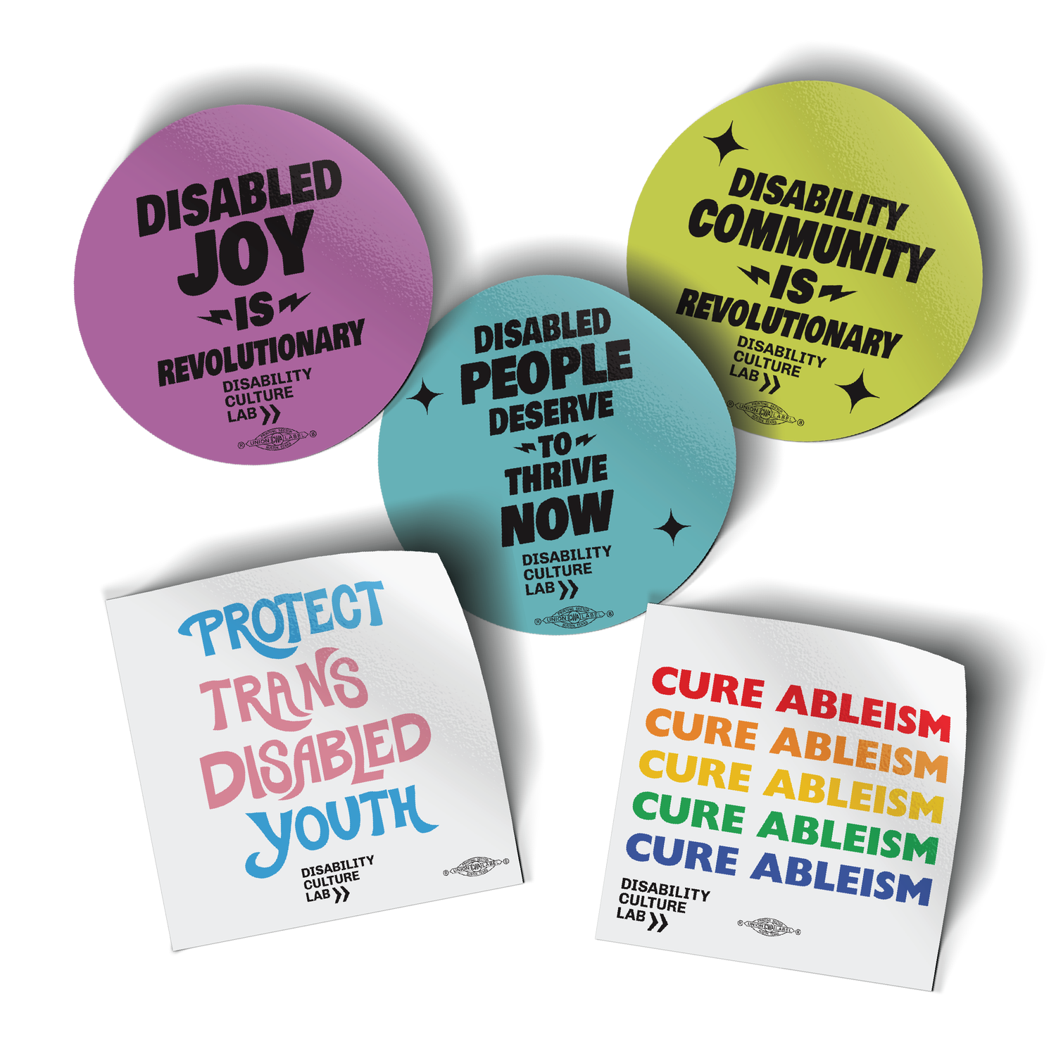 Five stickers on a white background. "Cure Ableism" sticker in rainbow colors for pride; "Protect Trans Disabled Youth" hand drawn in light pink, sky blue, and white. “Disabled People Deserve to Thrive Now” sticker is teal. “Disability Community is Revolutionary” sticker is neon yellow. “Disabled Joy is Revolutionary” sticker is bright purple.