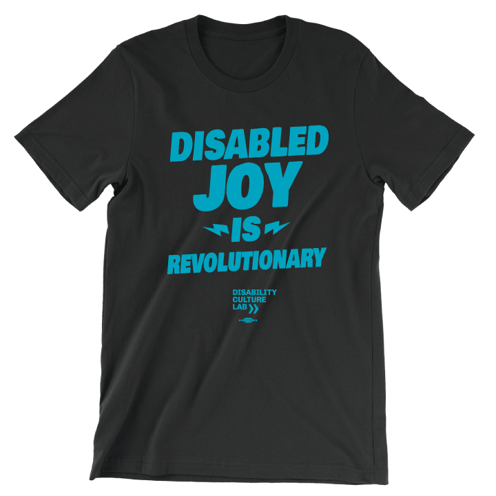 Black t-shirt with the turquoise words "Disabled Joy Is Revolutionary" and the turquoise Disability Culture Lab logo.