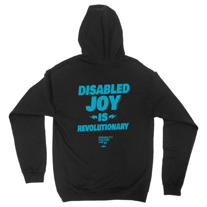 Back of black zip-up hoodie with the turquoise words "Disabled Joy Is Revolutionary" and the turquoise Disability Culture Lab logo.
