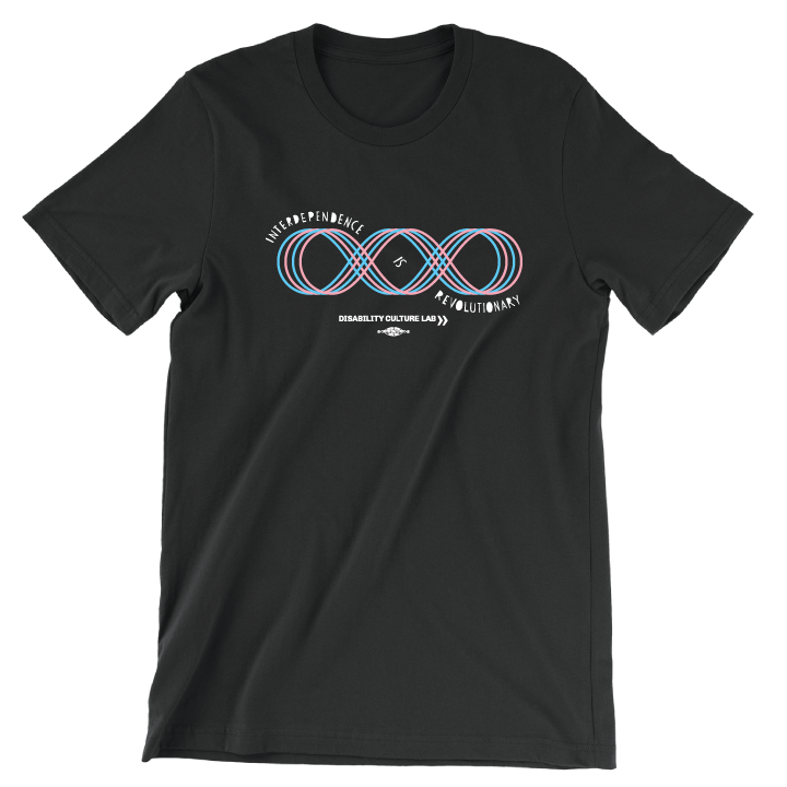 A black short sleeve T-shirt with a four line loop, like an infinity sign with an extra loop added to it. The loop lines are in blue and pink. The loops are a Contra dance diagram of a "Hey for Four," which is a dance move done with four dancers taking turns weaving through each other. Text reads, "Interdependence Is Revolutionary" and starts at the top left of the diagram, weaves into the center of the diagram and then ends at the bottom right. Below is the white Disability Culture Lab logo.